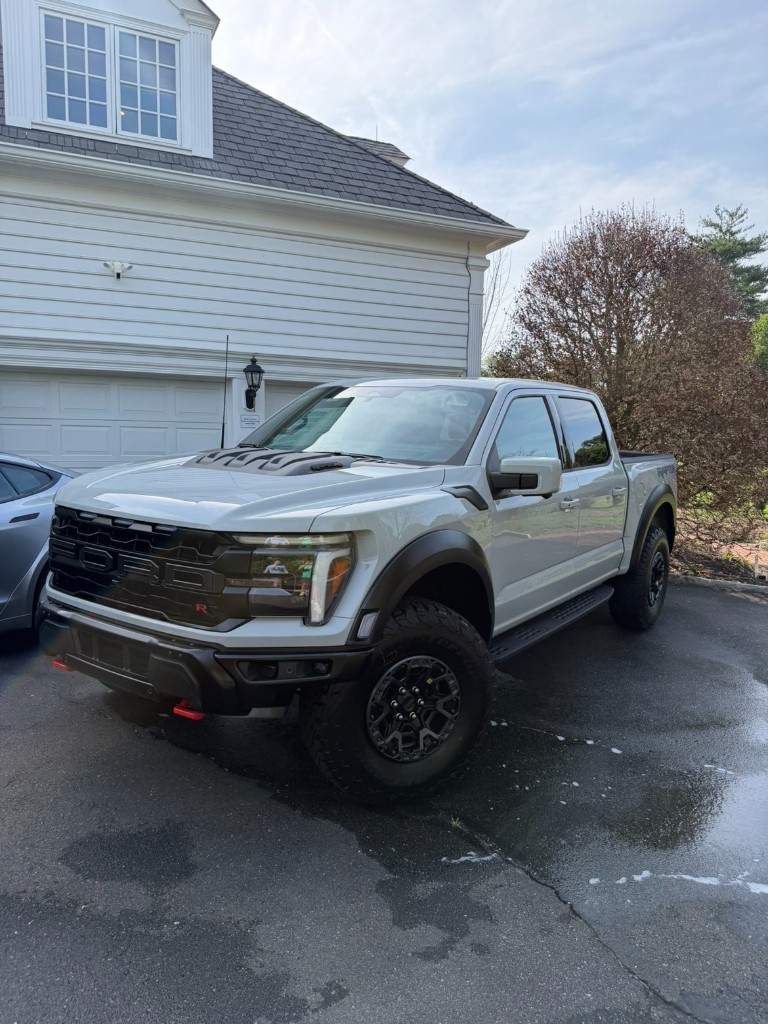 A freshly detailed truck in a customer's driveway